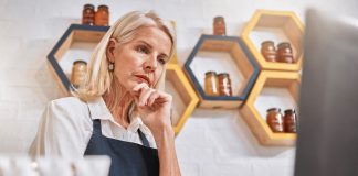 4 practical ways your SMB can cope with widespread inflation small business owner reviewing expenses during inflation